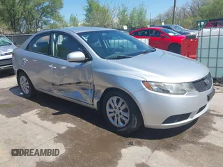 2010 Kia Forte LX with VIN KNAFT4A29A5061695, listed as a IAAI auction lot 42034559 with 114,470 mi miles. Bid and sale history available at carsss.com. Image 1.