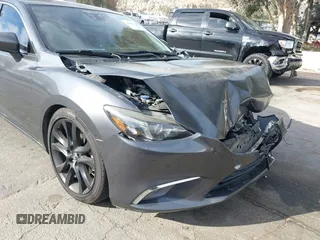 2016 Mazda Mazda6 i Grand Touring with VIN JM1GJ1W57G1441102, listed as a IAAI auction lot 41687057 with 144,876 mi miles. Bid and sale history available at carsss.com. Image 11.