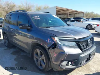 2020 Honda Passport Touring with VIN 5FNYF7H94LB004006, listed as a IAAI auction lot 41840191 with 52,237 mi miles and . Bid and sale history available at DreamBid. Image 1.