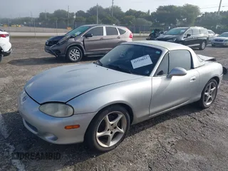 2003 Mazda MX-5 Miata Cloth with VIN JM1NB353730311899, listed as a IAAI auction lot 41929811 with 99,589 mi miles and . Bid and sale history available at DreamBid. Image 2.