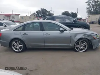 2015 Audi A6 Premium Plus z VIN WAUGFAFC6FN009203, wystawiony jako IAAI lot #42242726 z przebiegiem 69 163 mil mil oraz . Historia ofert i sprzedaży dostępna na DreamBid. Obrazek 13.