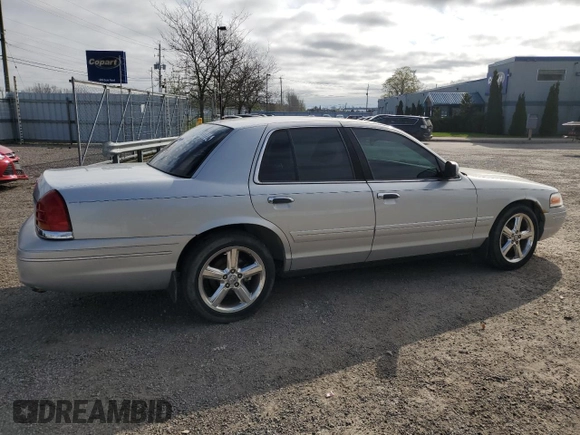 2003 Ford Crown Victoria LX z VIN 2FAFP74W03X122995, wystawiony jako Copart lot #55774415 z przebiegiem 234 485 mil mil oraz Czysty tytuł • Clean title. Historia ofert i sprzedaży dostępna na DreamBid. Obrazek 3.