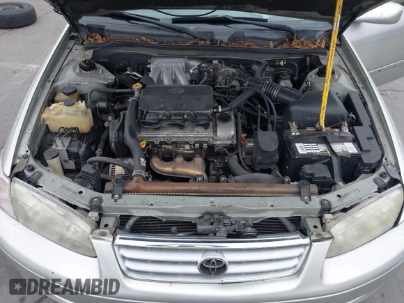 2001 Toyota Camry LE z VIN 4T1BF22K61U126600, wystawiony jako IAAI lot #42175093 z przebiegiem 294 276 mil mil oraz . Historia ofert i sprzedaży dostępna na DreamBid. Obrazek 10.