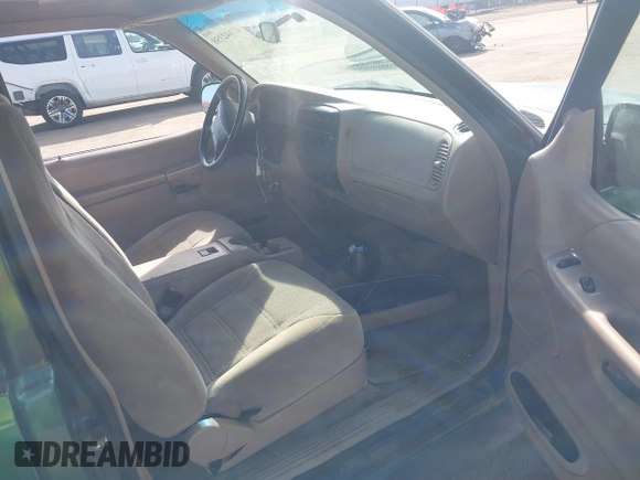 1999 Ford Explorer Sport with VIN 1FMYU22X2XUB19728, listed as a IAAI auction lot 41642358 with 128,788 mi miles and . Bid and sale history available at DreamBid. Image 5.