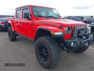 2021 Jeep Gladiator Rubicon z VIN 1C6JJTBG8ML561779, wystawiony jako IAAI lot #41796879 z przebiegiem 59 822 mil mil oraz . Historia ofert i sprzedaży dostępna na DreamBid. Obrazek 1.