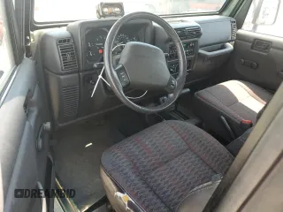 2000 Jeep Wrangler Sport с VIN 1J4FA49S4YP710633, выставлен на аукционе Copart как лот 65095875 с пробегом 107 613 миль миль и Чистый • Clean title. История ставок и продаж доступна на DreamBid. Изображение 8.