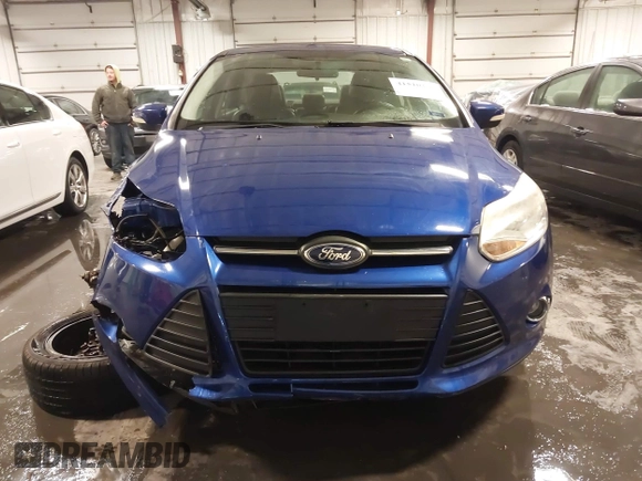 2013 Ford Focus SE z VIN 1FADP3F2XDL124732, wystawiony jako IAAI lot #41510140 z przebiegiem 69 819 mil mil oraz . Historia ofert i sprzedaży dostępna na DreamBid. Obrazek 13.