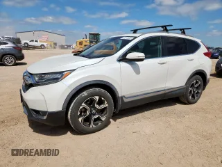 2018 Honda CR-V Touring z VIN 2HKRW2H9XJH676884, wystawiony jako Copart lot #60575355 z przebiegiem 75 414 mil mil oraz Czysty tytuł • Clean title. Historia ofert i sprzedaży dostępna na DreamBid. Obrazek 1.