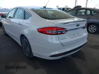 2017 Ford Fusion Hybrid Titanium with VIN 3FA6P0RU8HR229653, listed as a IAAI auction lot 42445182 with 163,279 mi miles and . Bid and sale history available at DreamBid. Image 3.