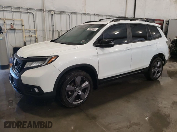 2020 Honda Passport Touring z VIN 5FNYF8H9XLB008647, wystawiony jako Copart lot #73320804 z przebiegiem 70 068 mil mil oraz Szkoda całkowita • Salvage title. Historia ofert i sprzedaży dostępna na DreamBid. Obrazek 1.