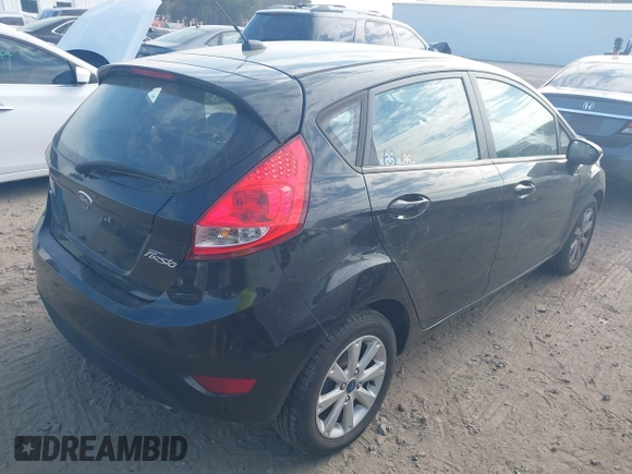 2013 Ford Fiesta SE with VIN 3FADP4EJ7DM140755, listed as a IAAI auction lot 41908366 with 68,744 mi miles. Bid and sale history available at carsss.com. Image 4.
