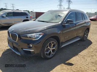 2018 BMW X1 xDrive28i with VIN WBXHT3C38J5K28174, listed as a Copart auction lot 57333385 with 50,064 mi miles and Salvage title. Bid and sale history available at DreamBid. Image 1.
