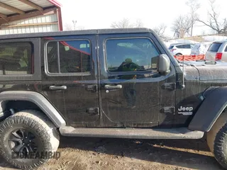 2018 Jeep Wrangler Unlimited Sport S z VIN 1C4HJXDG9JW172686, wystawiony jako IAAI lot #41742837 z przebiegiem 89 888 mil mil oraz . Historia ofert i sprzedaży dostępna na DreamBid. Obrazek 13.