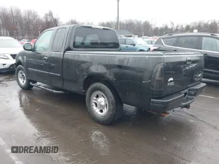 2002 Ford F-150 XL with VIN 1FTRX17W92NA80214, listed as a IAAI auction lot 41074951 with 164,048 mi miles. Bid and sale history available at carsss.com. Image 3.