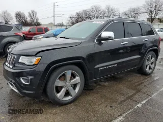 2015 Jeep Grand Cherokee Overland with VIN 1C4RJFCG7FC925995, listed as a Copart auction lot 85421214 with 142,266 mi miles and Salvage Title. Bid and sale history available at carsss.com. Image 1.