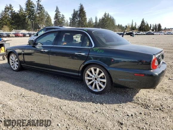 2008 Jaguar XJ with VIN SAJWA79BX8SH23430, listed as a Copart auction lot 51990785 with 140,454 mi miles and Salvage Title. Bid and sale history available at carsss.com. Image 2.