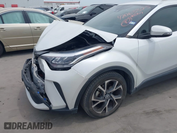2022 Toyota C-HR XLE z VIN NMTKHMBX2NR144638, wystawiony jako IAAI lot #42063325 z przebiegiem 22 823 mil mil oraz . Historia ofert i sprzedaży dostępna na DreamBid. Obrazek 6.