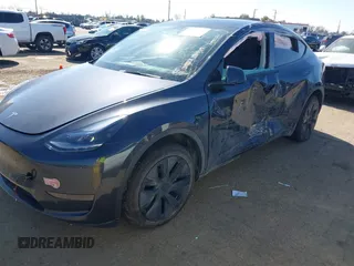 2024 Tesla Model Y with VIN 7SAYGDED8RF213796, listed as a IAAI auction lot 41634130 with 7,710 mi miles and . Bid and sale history available at DreamBid. Image 18.