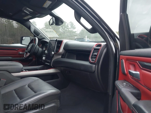 2019 Ram 1500 Rebel z VIN 1C6SRFLT1KN722064, wystawiony jako IAAI lot #41513201 z przebiegiem 113 559 mil mil oraz . Historia ofert i sprzedaży dostępna na DreamBid. Obrazek 5.