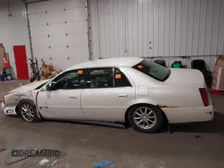 2003 Cadillac DeVille with VIN 1G6KD54Y63U178022, listed as a IAAI auction lot 42076667 with 141,863 mi miles. Bid and sale history available at carsss.com. Image 14.