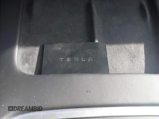 2025 Tesla Model Y Long Range with VIN 7SAYGDEE3SF218015, listed as a IAAI auction lot 41448106 with 1,588 mi miles and . Bid and sale history available at carsss.com. Image 11.