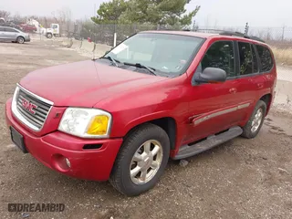 2003 GMC Envoy SLE with VIN 1GKDT13S932334925, listed as a IAAI auction lot 42071477 with 232,935 mi miles. Bid and sale history available at carsss.com. Image 2.