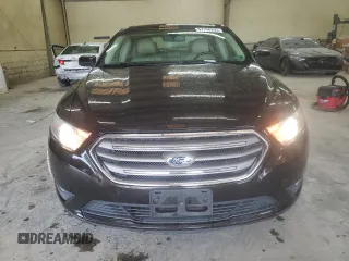 2014 Ford Taurus SEL z VIN 1FAHP2E80EG128686, wystawiony jako Copart lot #57158255 z przebiegiem 69 529 mil mil oraz Szkoda całkowita • Salvage title. Historia ofert i sprzedaży dostępna na DreamBid. Obrazek 5.
