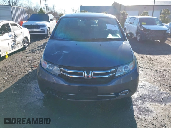 2014 Honda Odyssey Touring with VIN 5FNRL5H94EB081267, listed as a IAAI auction lot 41199509 with 146,827 mi miles and . Bid and sale history available at DreamBid. Image 12.