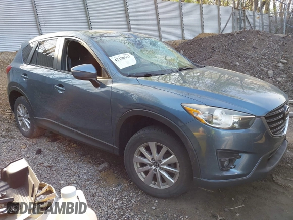2016 Mazda CX-5 Touring with VIN JM3KE4CY5G0771252, listed as a IAAI auction lot 42138637 with 106,767 mi miles and . Bid and sale history available at carsss.com. Image 13.