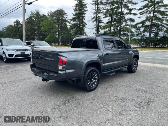 2022 Toyota Tacoma Limited with VIN 3TMGZ5AN7NM458988, listed as a Copart auction lot 65398105 with 32,115 mi miles and Salvage title. Bid and sale history available at DreamBid. Image 4.