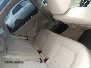 2014 Volkswagen Passat SEL Premium z VIN 1VWCN7A32EC061384, wystawiony jako IAAI lot #42210170 z przebiegiem 152 836 mil mil oraz . Historia ofert i sprzedaży dostępna na DreamBid. Obrazek 8.