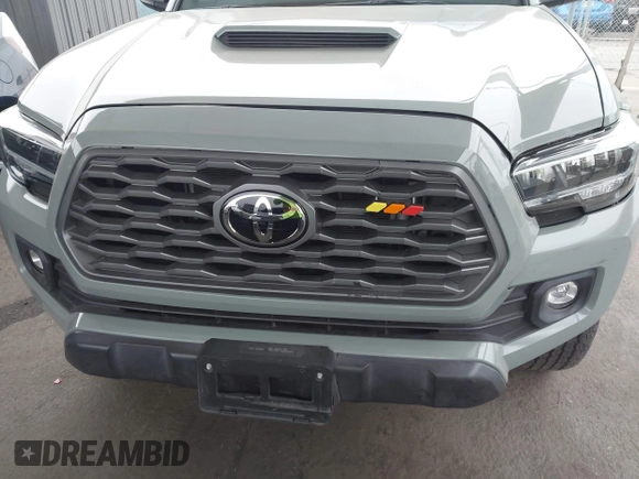 2023 Toyota Tacoma SR z VIN 3TMCZ5AN1PM602567, wystawiony jako IAAI lot #42355648 z przebiegiem 32 472 mil mil oraz . Historia ofert i sprzedaży dostępna na DreamBid. Obrazek 18.