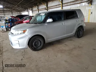 2012 Scion xB with VIN JTLZE4FE5CJ023537, listed as a Copart auction lot 55863315 with 230,648 mi miles and Salvage Title. Bid and sale history available at DreamBid. Image 1.