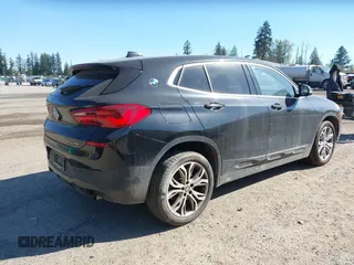 2018 BMW X2 xDrive28i with VIN WBXYJ5C30JEF69802, listed as a IAAI auction lot 42061382 with 55,138 mi miles. Bid and sale history available at carsss.com. Image 4.