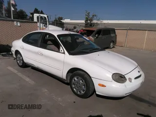 1998 Ford Taurus LX z VIN 1FAFP52U5WG219335, wystawiony jako IAAI lot #38337211 z przebiegiem 202 073 mil mil oraz . Historia ofert i sprzedaży dostępna na DreamBid. Obrazek 1.