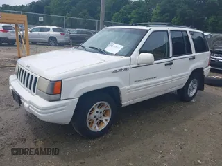 1996 Jeep Grand Cherokee Limited z VIN 1J4GZ78YXTC191527, wystawiony jako IAAI lot #42352616 z przebiegiem 325 927 mil mil oraz . Historia ofert i sprzedaży dostępna na DreamBid. Obrazek 18.