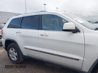 2012 Jeep Grand Cherokee Laredo with VIN 1C4RJFAG5CC224032, listed as a IAAI auction lot 42069334 with 106,614 mi miles. Bid and sale history available at carsss.com. Image 14.