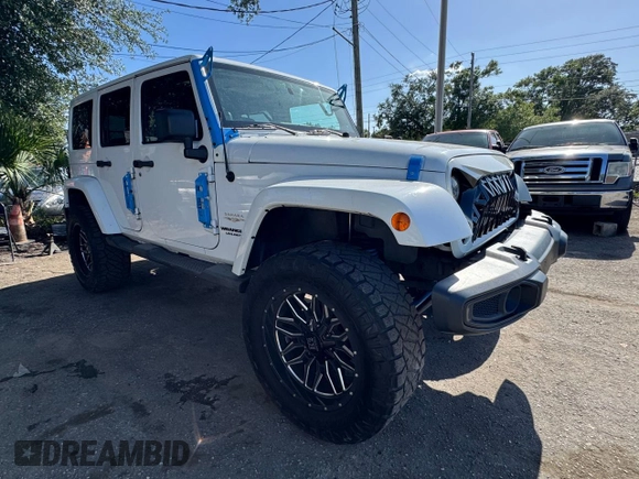 2012 Jeep Wrangler Unlimited Altitude z VIN 1C4HJWEG5CL222948, wystawiony jako Copart lot #61101825 z przebiegiem 106 991 mil mil oraz Czysty tytuł • Clean title. Historia ofert i sprzedaży dostępna na DreamBid. Obrazek 1.