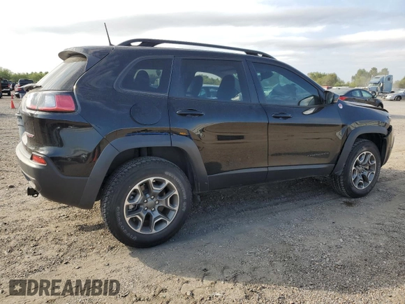 2022 Jeep Cherokee Trailhawk with VIN 1C4PJMBX8ND554044, listed as a Copart auction lot 82687464 with 13,353 mi miles and Salvage Title. Bid and sale history available at carsss.com. Image 3.
