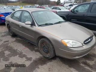 2005 Ford Taurus SE with VIN 1FAFP53215A127489, listed as a IAAI auction lot 40940239 with 127,180 mi miles. Bid and sale history available at carsss.com. Image 1.