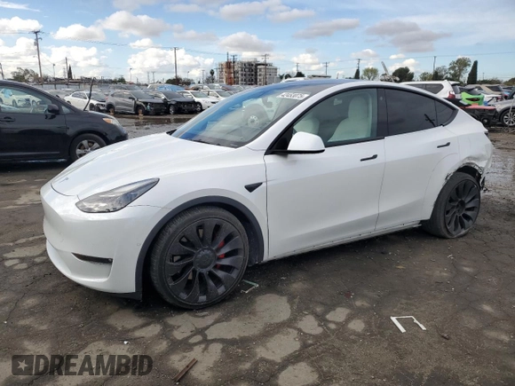 2021 Tesla Model Y Performance with VIN 5YJYGDEF4MF201815, listed as a Copart auction lot 42453075 with 76,888 mi miles and Salvage Title. Bid and sale history available at DreamBid. Image 1.