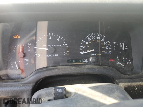 1999 Jeep Cherokee Sport z VIN 1J4FF68S3XL597049, wystawiony jako Copart lot #58736325 z przebiegiem 134 684 mil mil oraz Nie do naprawy • Non repairable. Historia ofert i sprzedaży dostępna na DreamBid. Obrazek 9.