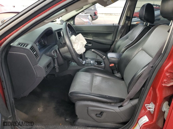 2010 Jeep Grand Cherokee Laredo with VIN 1J4RR4GT0AC123716, listed as a Copart auction lot 86388444 with 189,490 mi miles and Salvage Title. Bid and sale history available at carsss.com. Image 7.