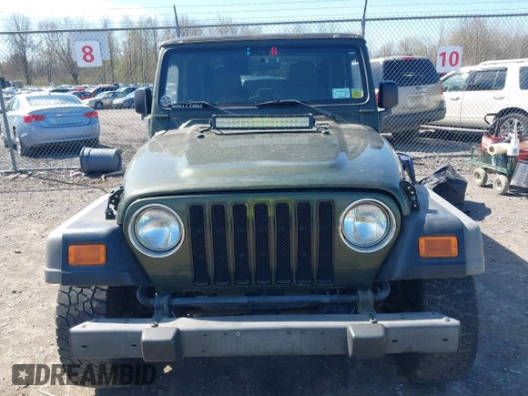 2006 Jeep Wrangler SE with VIN 1J4FA29116P763914, listed as a IAAI auction lot 42140140 with 107,161 mi miles. Bid and sale history available at carsss.com. Image 13.