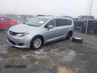 2018 Chrysler Pacifica Touring L with VIN 2C4RC1BGXJR142295, listed as a IAAI auction lot 41952592 with 135,092 mi miles and . Bid and sale history available at DreamBid. Image 2.
