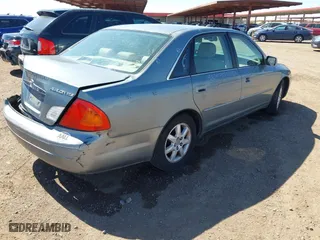 2001 Toyota Avalon XL w/Bucket Seats with VIN 4T1BF28B31U150439, listed as a IAAI auction lot 41868466 with 210,828 mi miles. Bid and sale history available at carsss.com. Image 4.