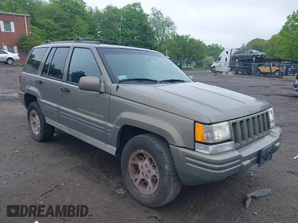 1998 Jeep Grand Cherokee Limited z VIN 1J4GZ78Y5WC261391, wystawiony jako IAAI lot #42275913 z przebiegiem 180 552 mil mil oraz . Historia ofert i sprzedaży dostępna na DreamBid. Obrazek 1.