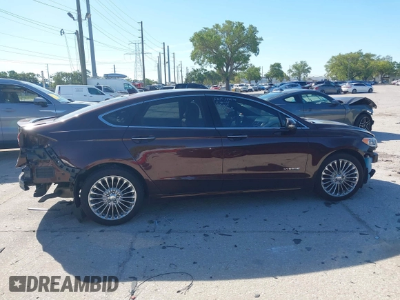 2019 Ford Fusion Hybrid Titanium with VIN 3FA6P0RU2KR123786, listed as a IAAI auction lot 41857026 with 49,604 mi miles. Bid and sale history available at carsss.com. Image 14.