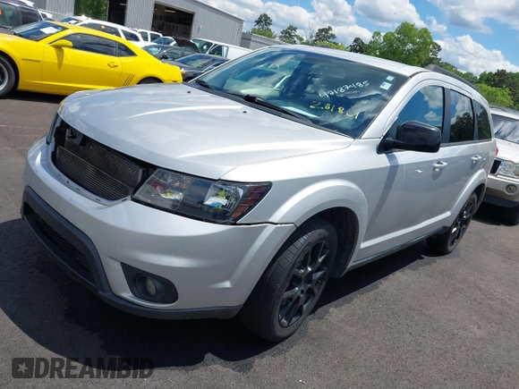 2014 Dodge Journey SXT with VIN 3C4PDCBB0ET281861, listed as a IAAI auction lot 42187485 with 124,191 mi miles and . Bid and sale history available at DreamBid. Image 2.