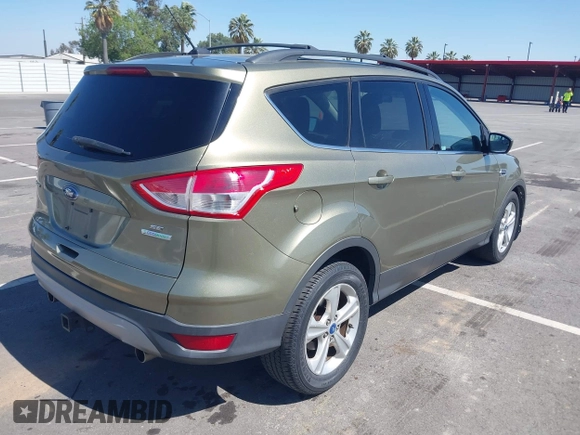 2013 Ford Escape SE with VIN 1FMCU0G99DUC05901, listed as a IAAI auction lot 42194672 with 121,435 mi miles and . Bid and sale history available at DreamBid. Image 4.
